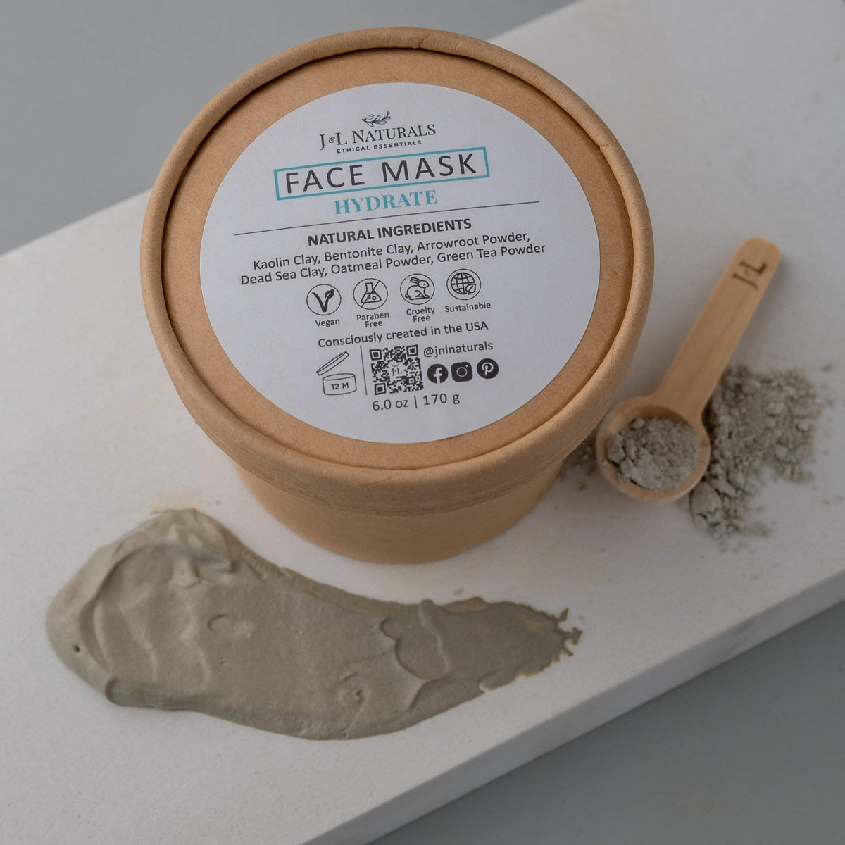 Hydrate face mask jar with light blue cream texture on soft white background.