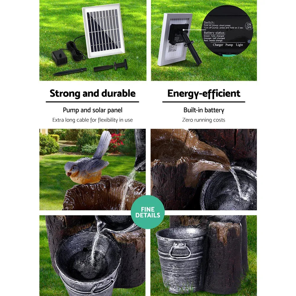 Three black bucket-shaped tiers stacked as garden bird bath with solar panel on top.