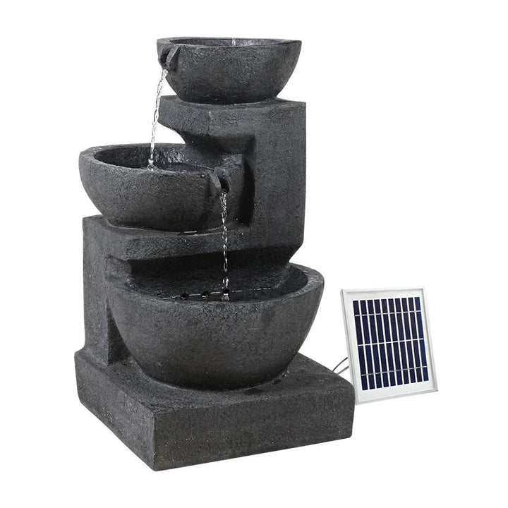 Three-tier blue polyresin solar bird bath fountain with water flowing from top to bottom