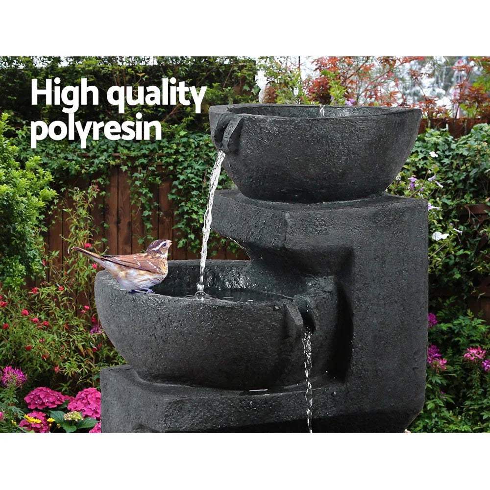 Top view of blue solar bird bath fountain showing three water tiers with flowing water