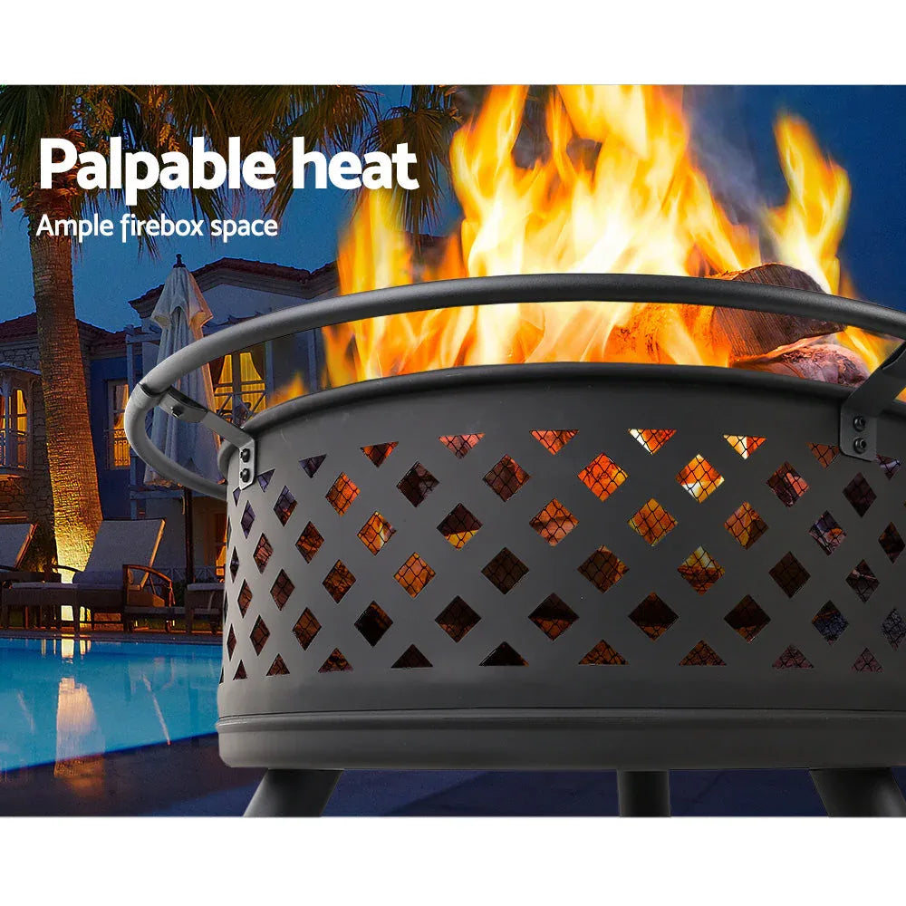 Outdoor fire pit with mesh dome cover and tools on a wooden deck.