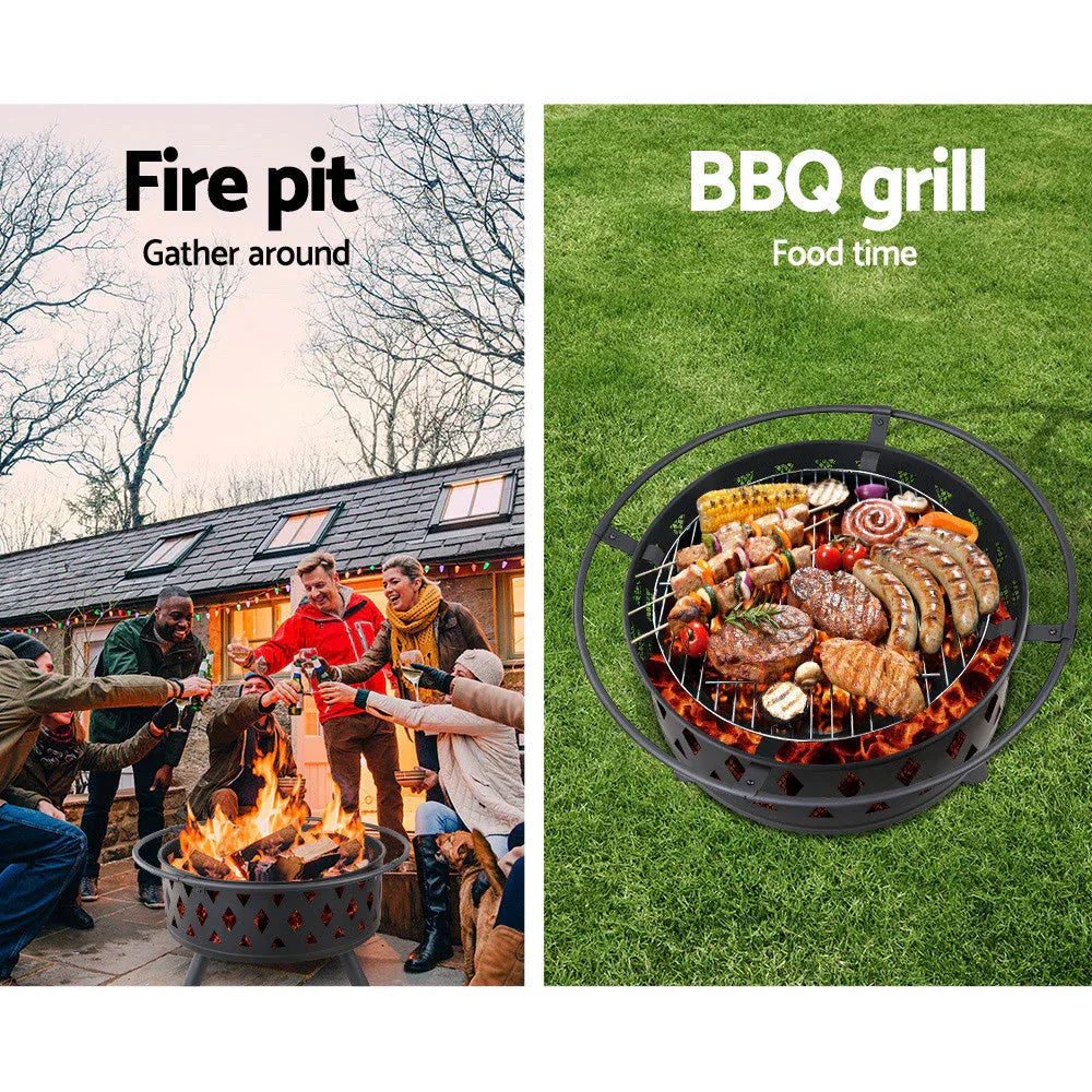Fire pit with glowing fire inside and surrounding safety ring in outdoor setting