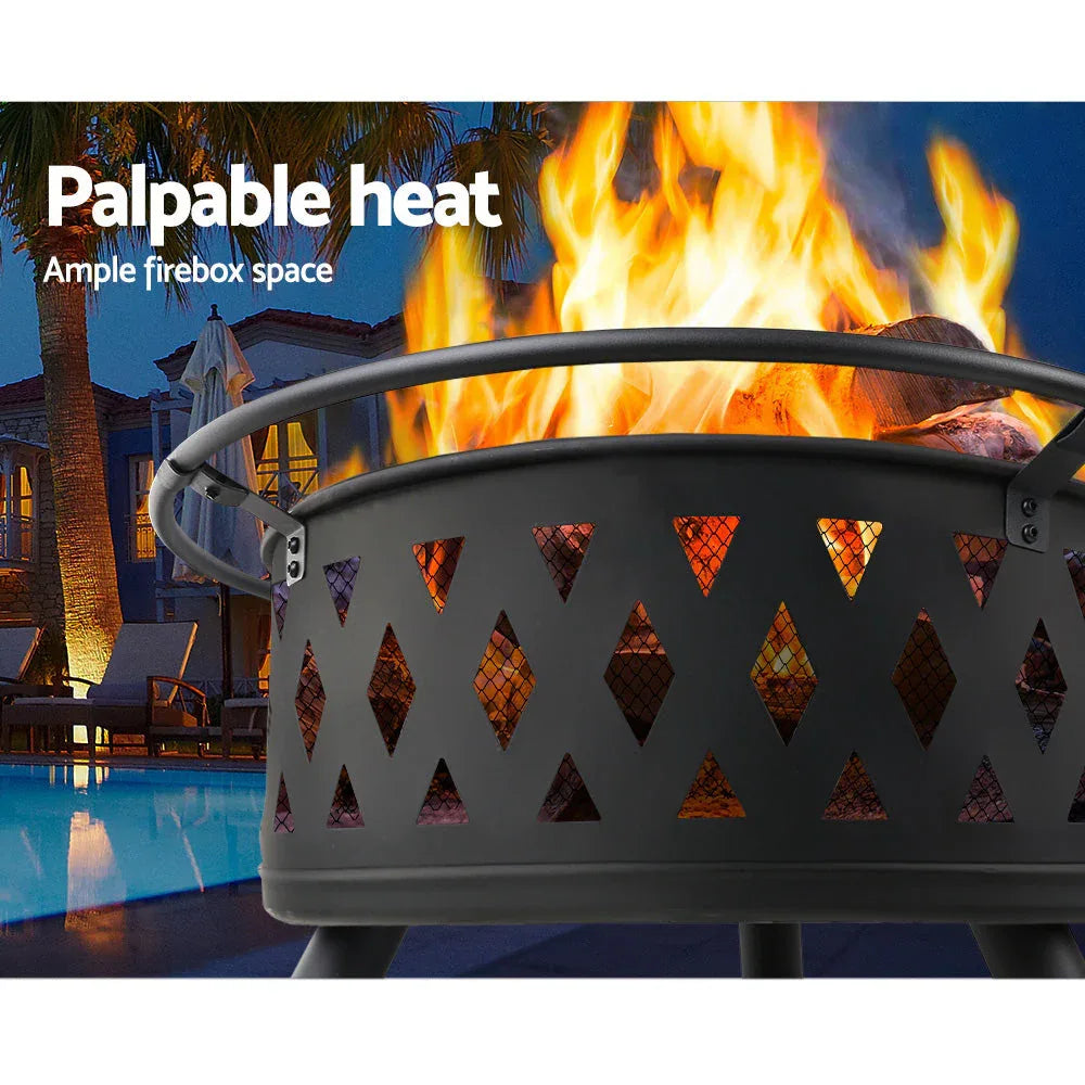 Outdoor fire pit with food grilling on stainless steel grate under mesh dome