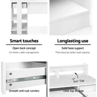 White computer desk fully assembled with storage shelves and keyboard tray.