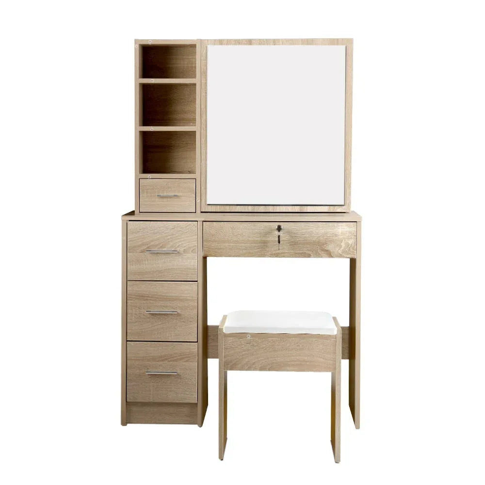 Spacious tabletop of dressing table with makeup accessories and cosmetics.