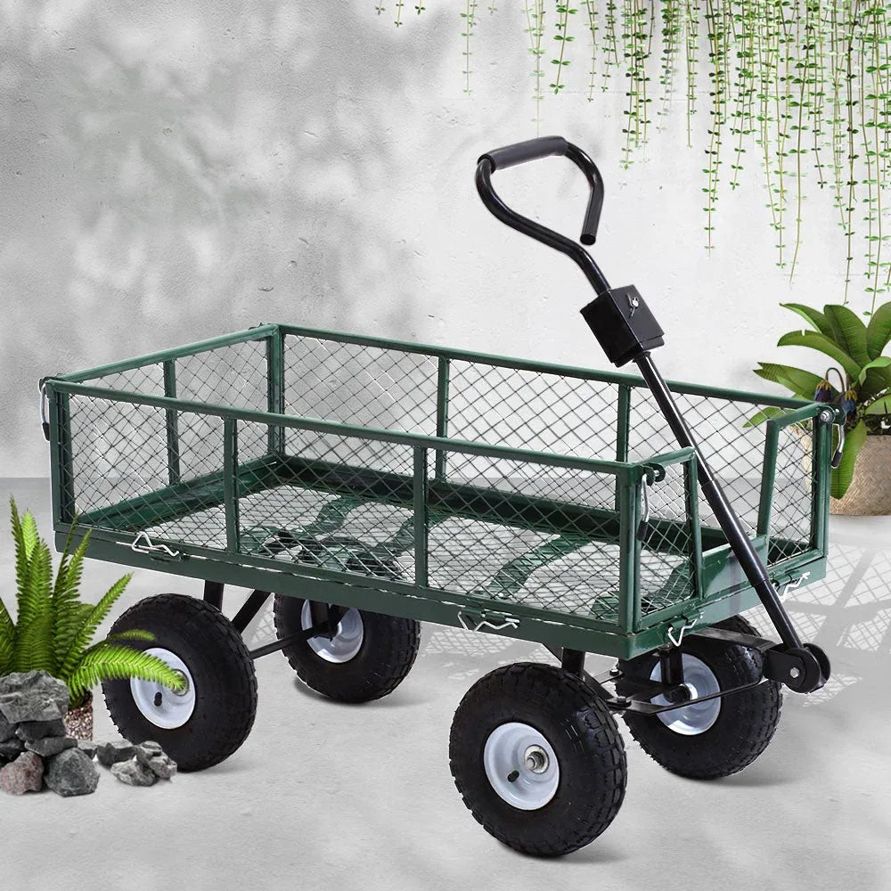 Green garden cart shown with ATV attachment for towing in yard.