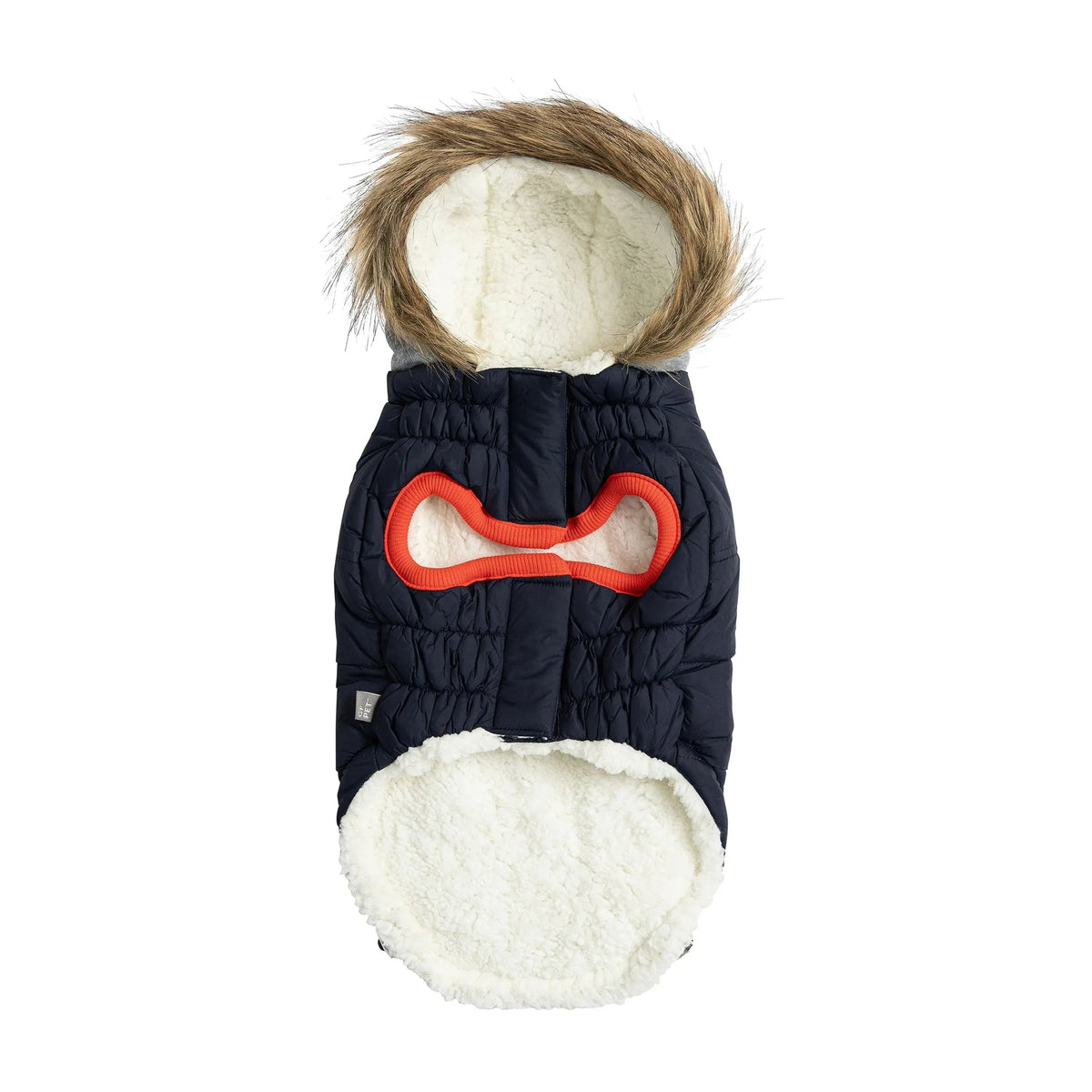 Close-up of navy parka's water repellent fabric and contrast pocket tabs on dog model.