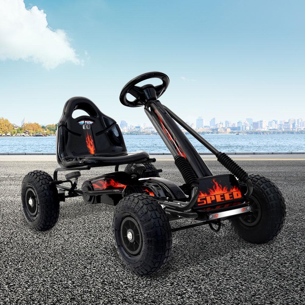 Black pedal go kart angled front view showing sleek frame and durable rubber tires