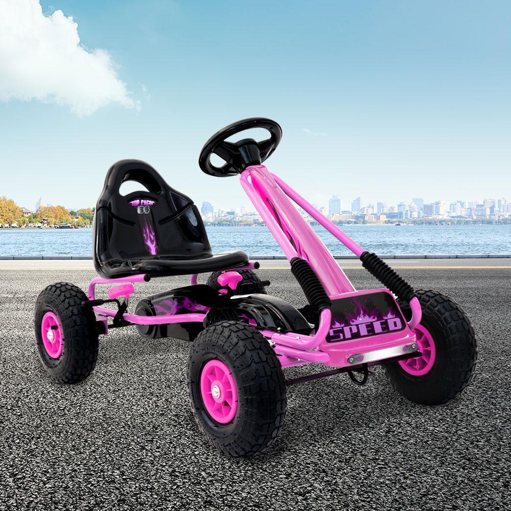 Front-facing kids go kart in vibrant red with durable plastic body and steering wheel.