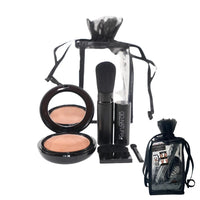 GO NATURAL travel gift set displayed with powder compact and brush in black carrying pouch.