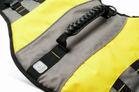 Yellow dog life vest showing adjustable waist strap and D-ring for leash attachment