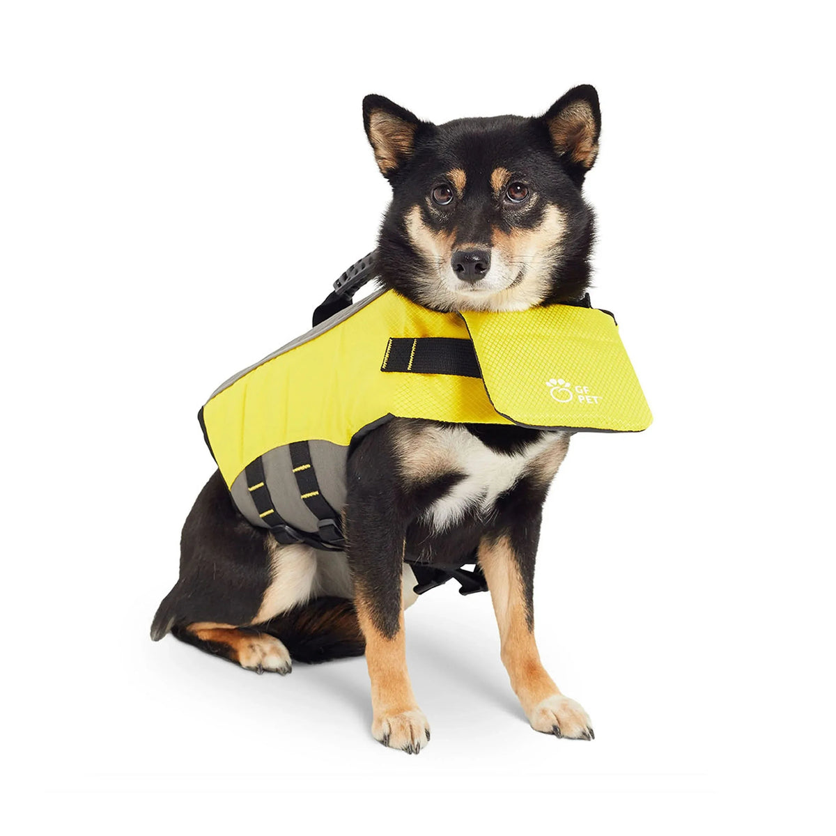 Side view of bright yellow dog life jacket highlighting sturdy handle and chest flap