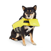 Back view of bright yellow dog life vest displaying sturdy handle and D-ring for leash attachment.
