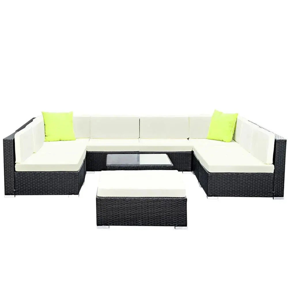 Top-down view of outdoor wicker patio lounge set with cushions and table