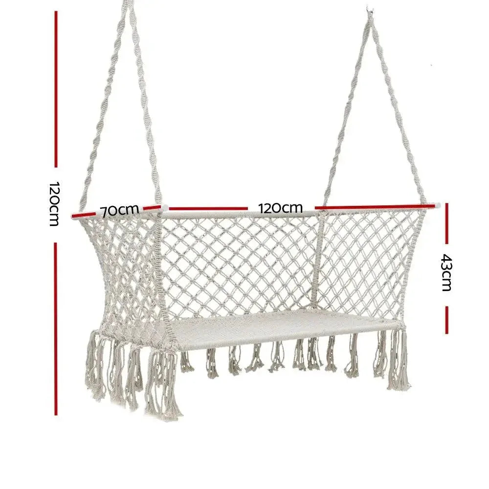 Close-up of the cream fabric and woven tassels on a double hammock chair.