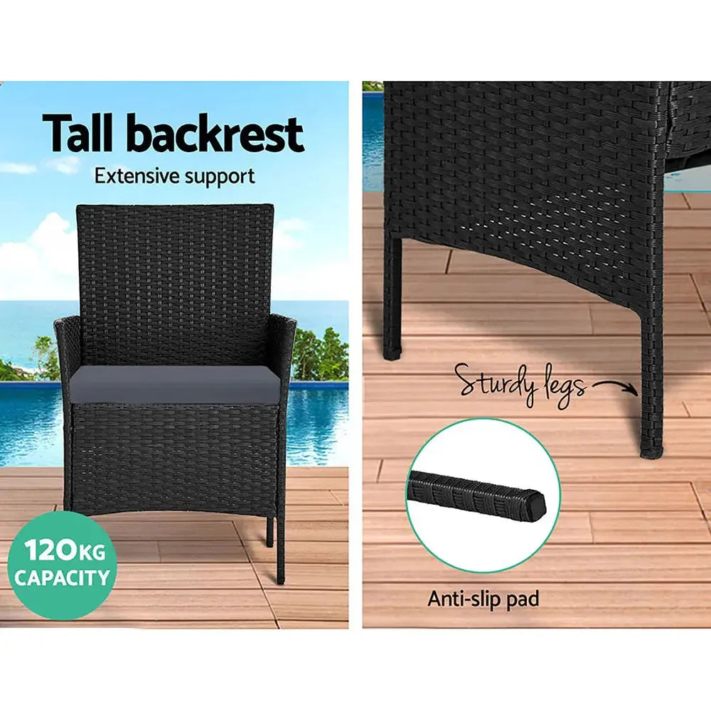 Black storage cover layered over Gardeon rattan outdoor lounge furniture for protection.