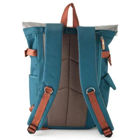 Close-up of blue backpack's magnetic snap side pocket and red inner lining.