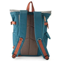 Close-up of blue backpack's magnetic snap side pocket and red inner lining.