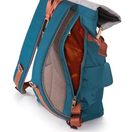 Inside view of blue rolltop backpack showing zippered and open compartments in red lining.