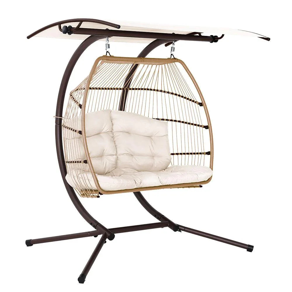 Gardeon hanging egg chair with broad adjustable canopy on steel frame in outdoor garden setting.