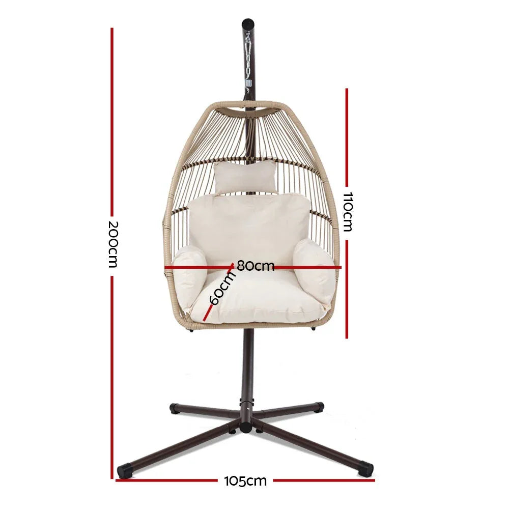 Side view of the egg-shaped hanging swing chair attached to a steel frame with rope.