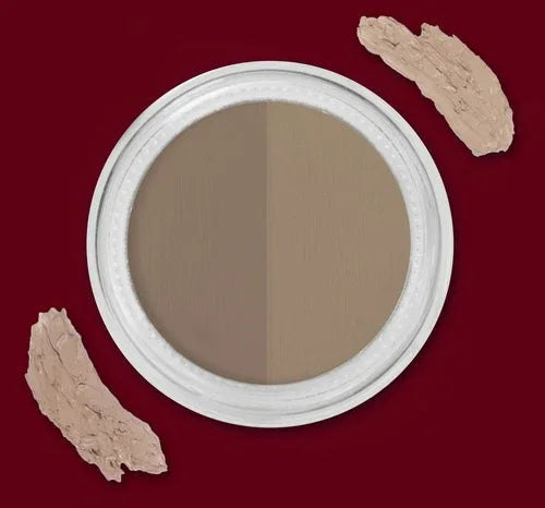 Model applying eyebrow gel with brush, showing defined brows with darker arch and lighter inner fill