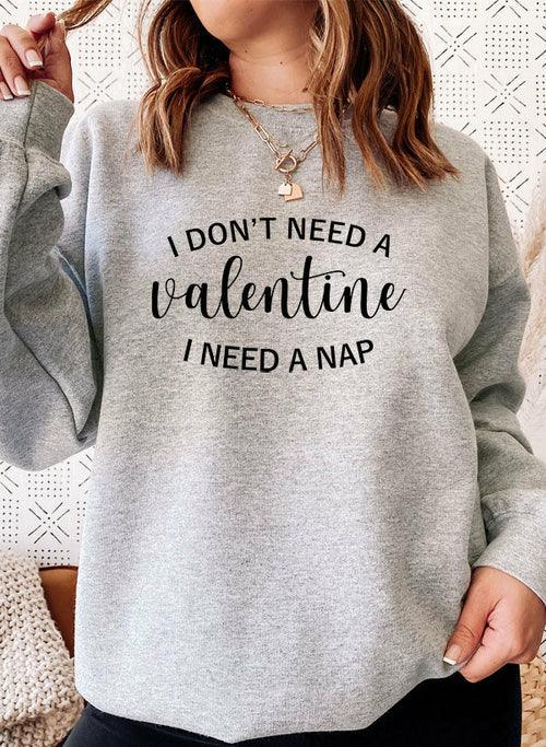 Side view of person wearing black sweatshirt with 'I Don't Need A Valentine' text.