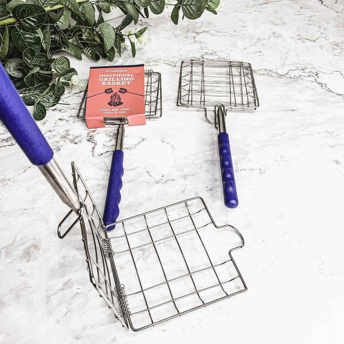 Close-up of Grilling Basket stainless steel mesh holding food for open-fire cooking