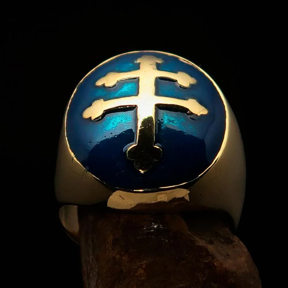 Close-up of oval domed men's blue Cross Lorraine ring showing blue enamel on solid brass.