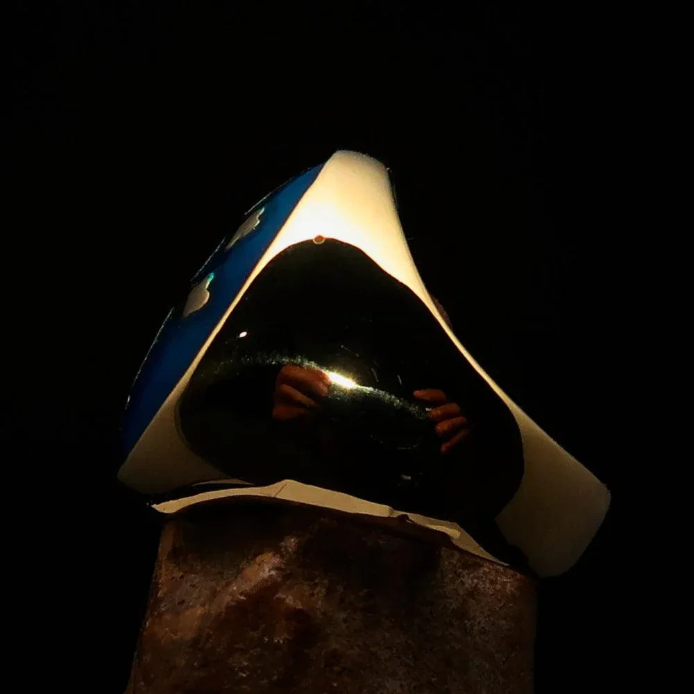 Side angle of polished men's ring showing blue enamel Cross Lorraine on brass base.