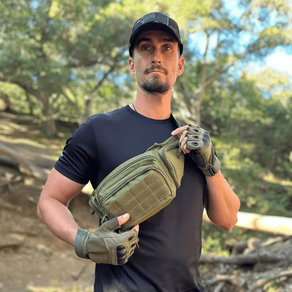 Front view of green tactical fingerless gloves with padded knuckles and adjustable wrist strap.
