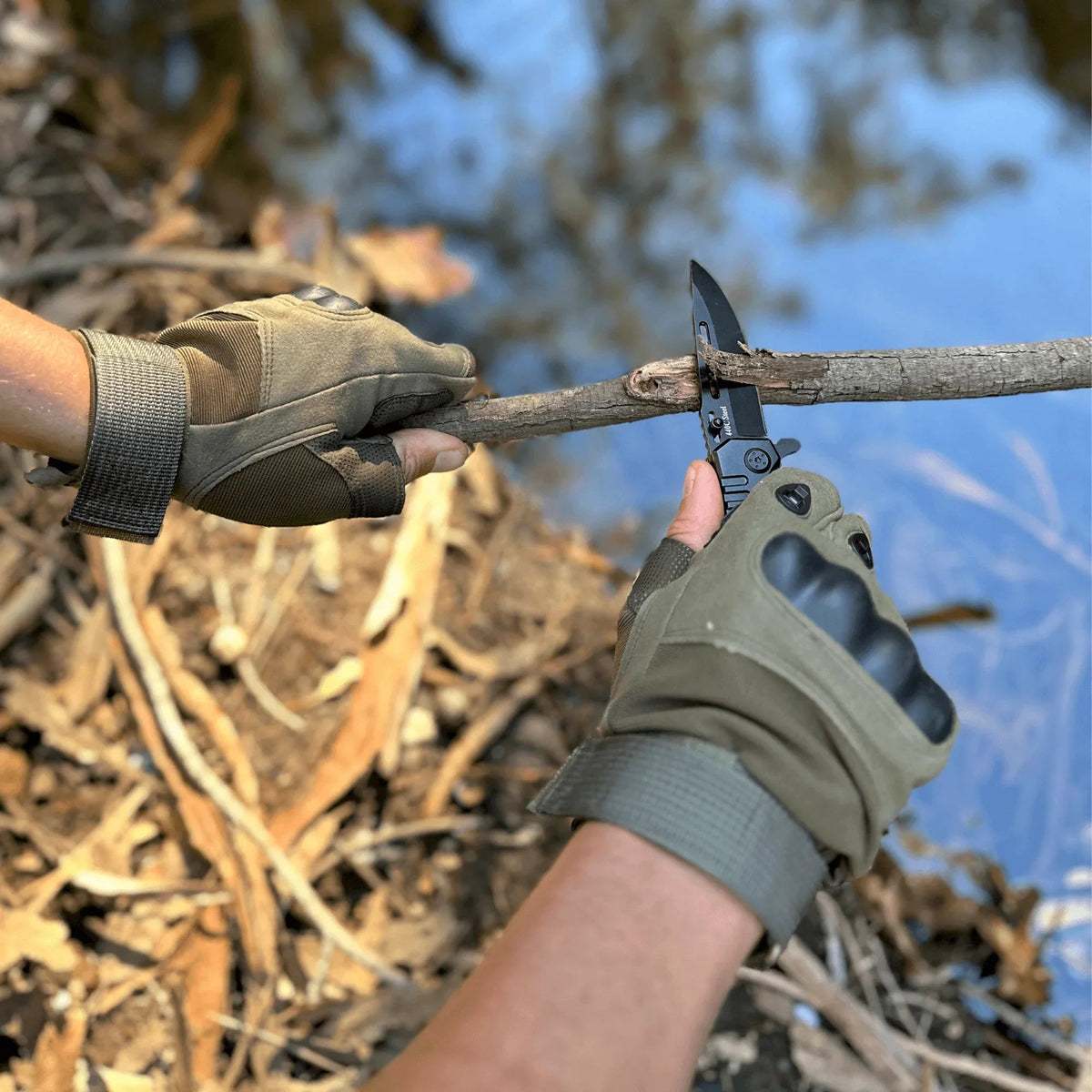 Side angle of green fingerless tactical gloves showing textured grip and knuckle protection.