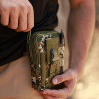 Tactical MOLLE pouch open with contents showing organized interior compartments.