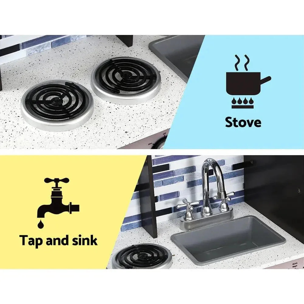 Pretend play kitchen showing wooden stove knobs, sink faucet, and hanging utensils for kids.
