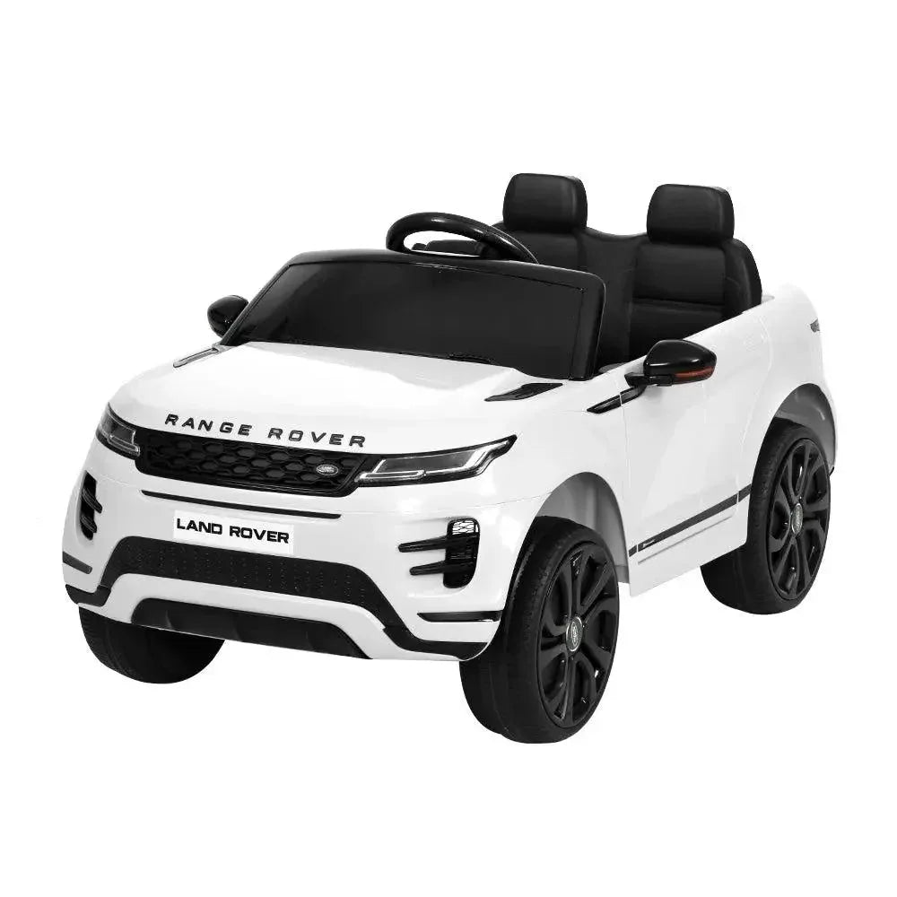 White kids ride on Land Rover Evoque electric car with steering wheel and realistic front design.