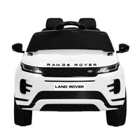 Front angle of white kids 12V Land Rover ride on car highlighting headlights and grill.