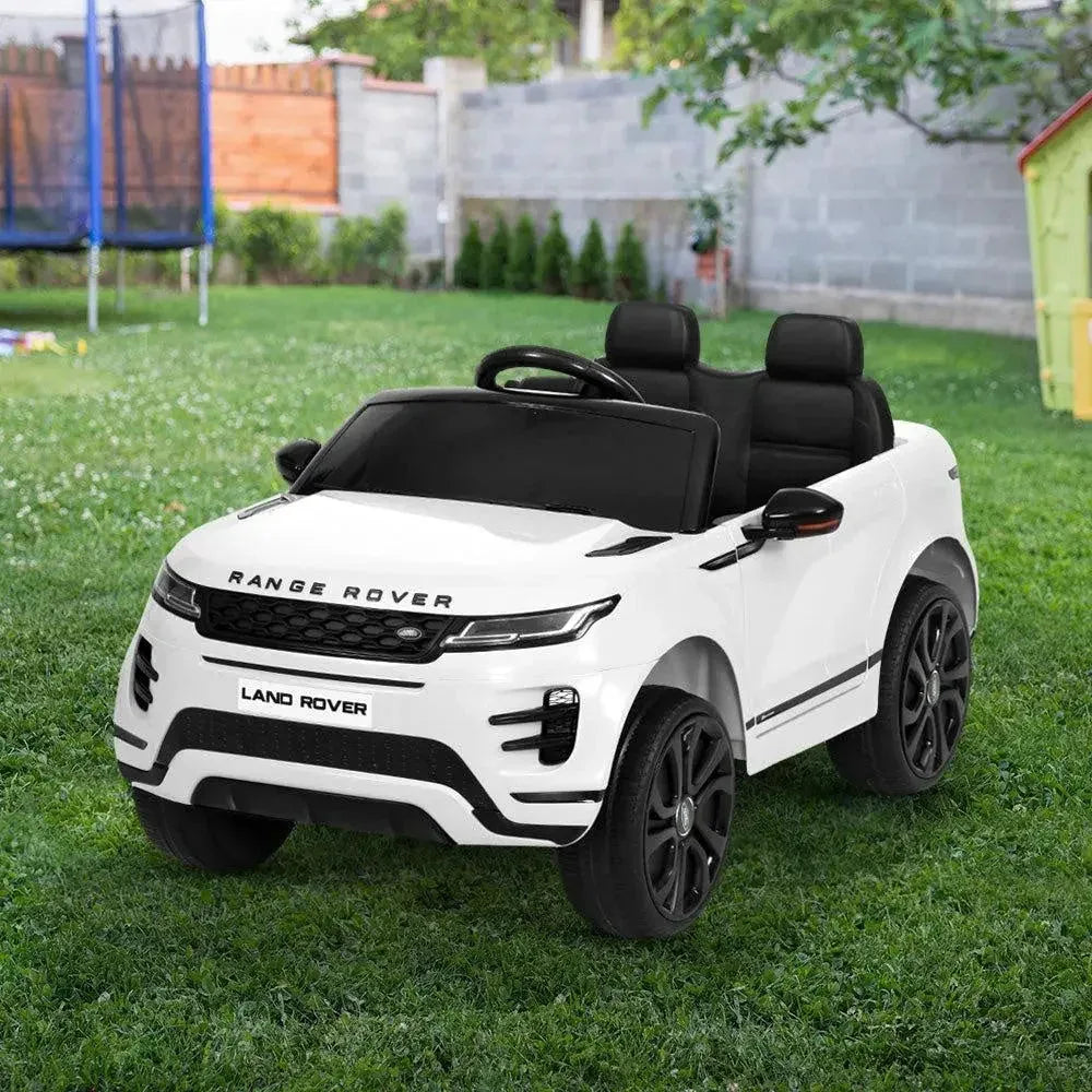 White ride on Land Rover toy car angled to display both front and side features.