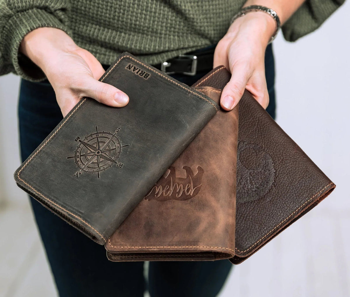 Leather journal held by person, highlighting texture and size of the journal