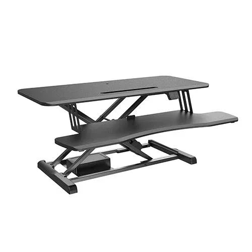 BRATECK Electric sit-stand desk converter with keyboard tray on a modern office desk
