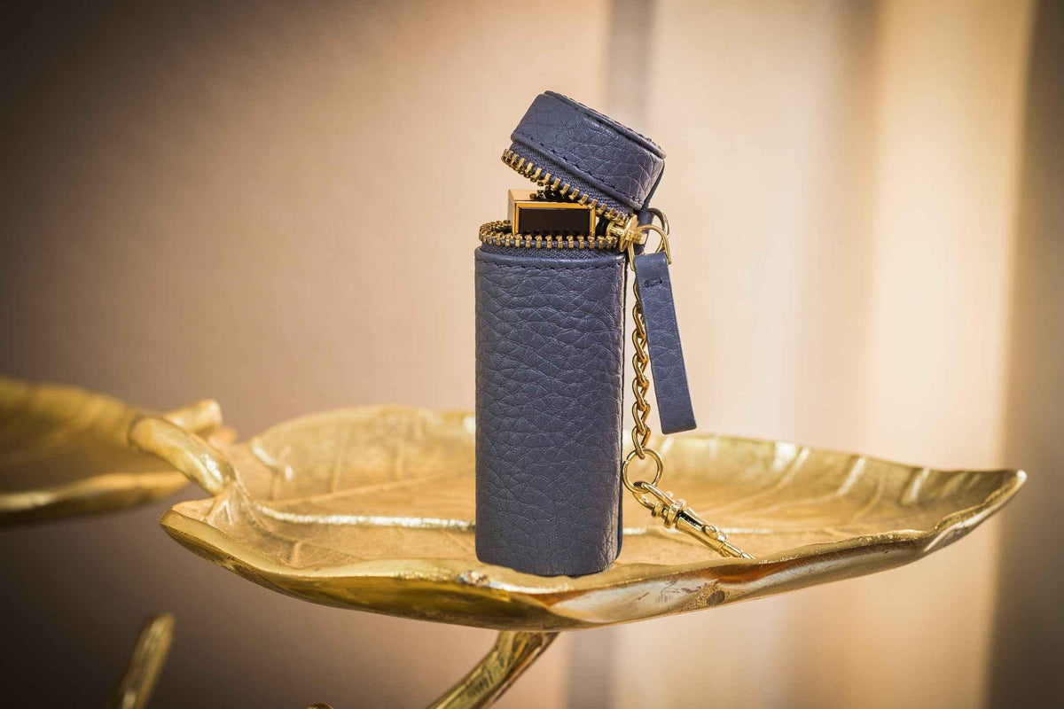 Close-up of a pebble leather lipstick keeper pouch showing texture and stitching