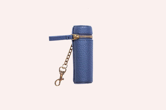 Genuine pebble leather lipstick holder pouch in soft beige on wooden surface