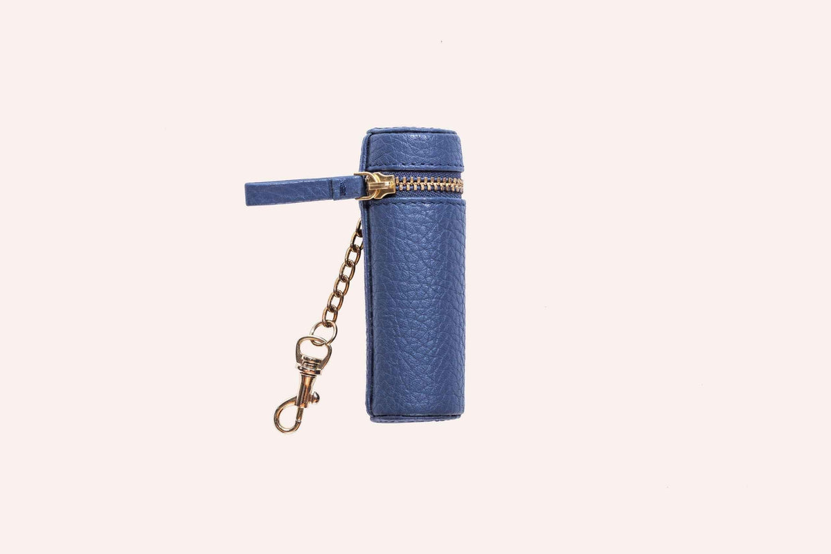 Genuine pebble leather lipstick holder pouch in soft beige on wooden surface