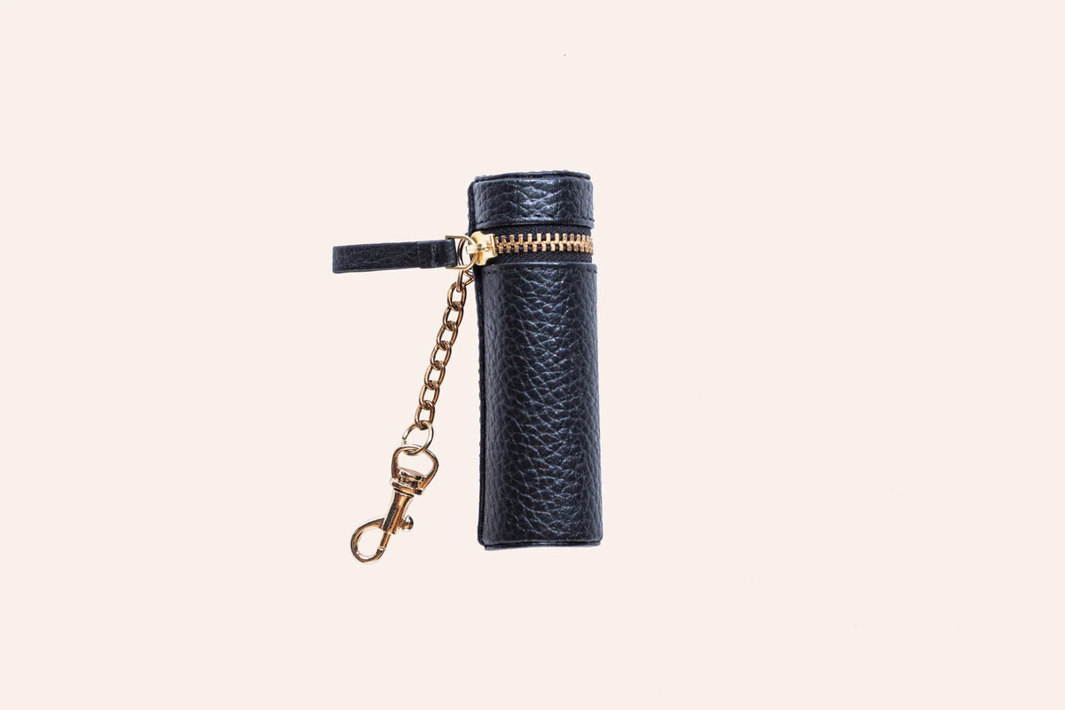 Open pebble leather lipstick holder showing interior stitching and pocket
