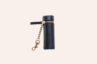 Open pebble leather lipstick holder showing interior stitching and pocket