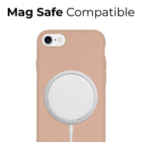 Phone case with pastel pink color supporting MagSafe charging on an iPhone.