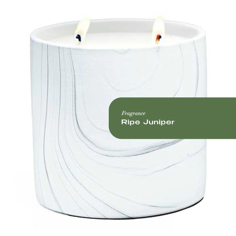 White marble ceramic candle vessel with gray and black swirls, 17oz Ripe Juniper scent.