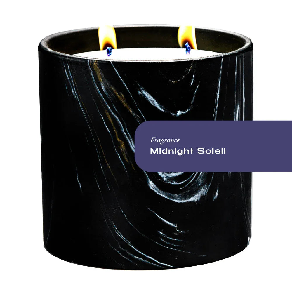 Black ceramic candle with white and gold swirls in Marquina design, 17oz size