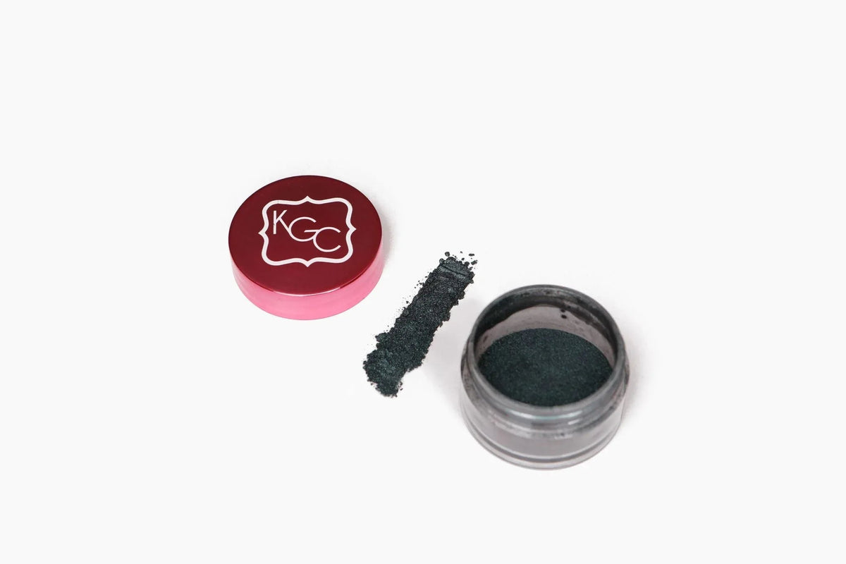 Close-up of Meatpacking Shimmer Powder in rich forest green shimmer with textured surface.
