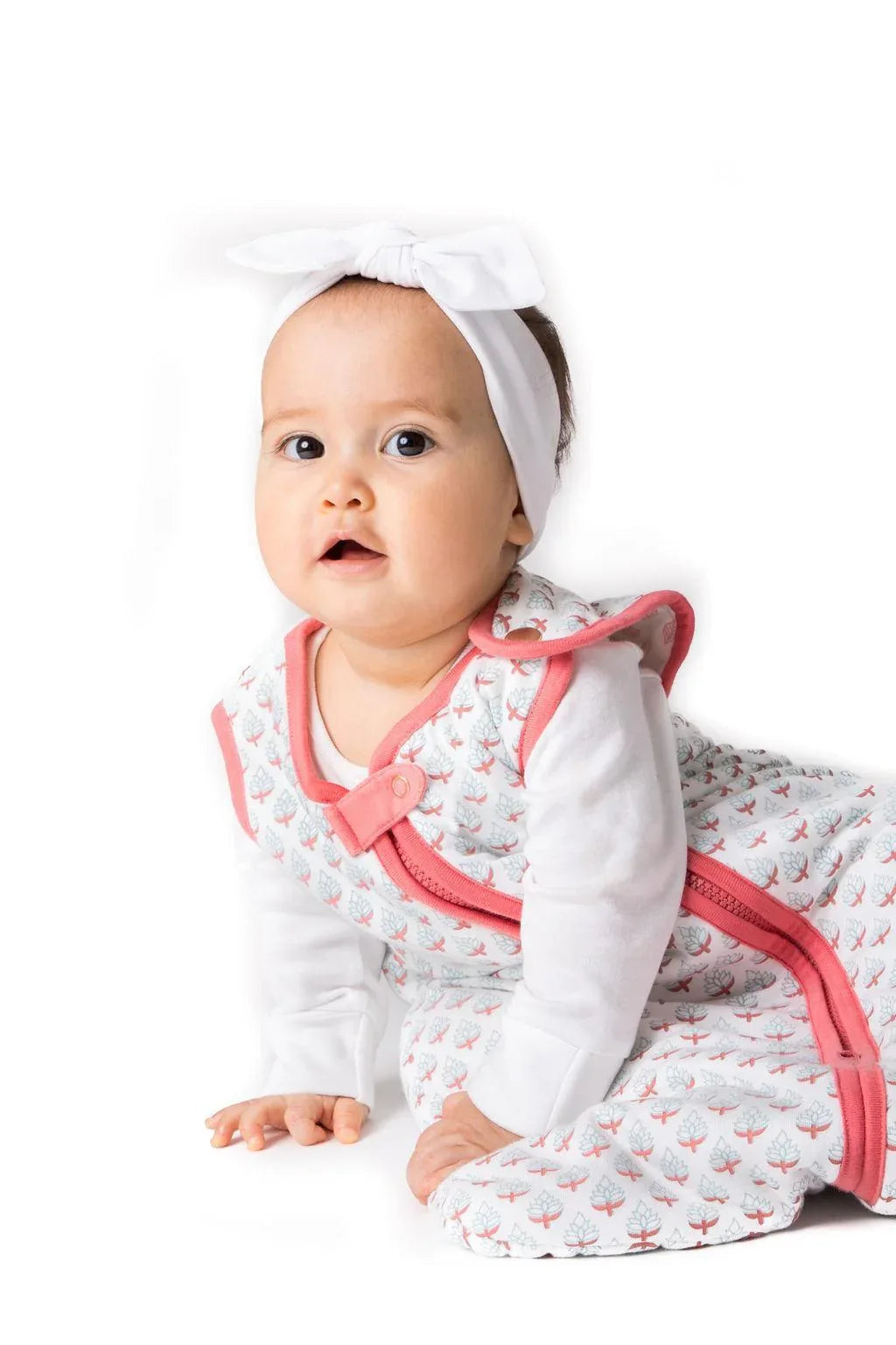 Lightweight baby sleep bag laid flat showing soft yellow fabric with minimal design.