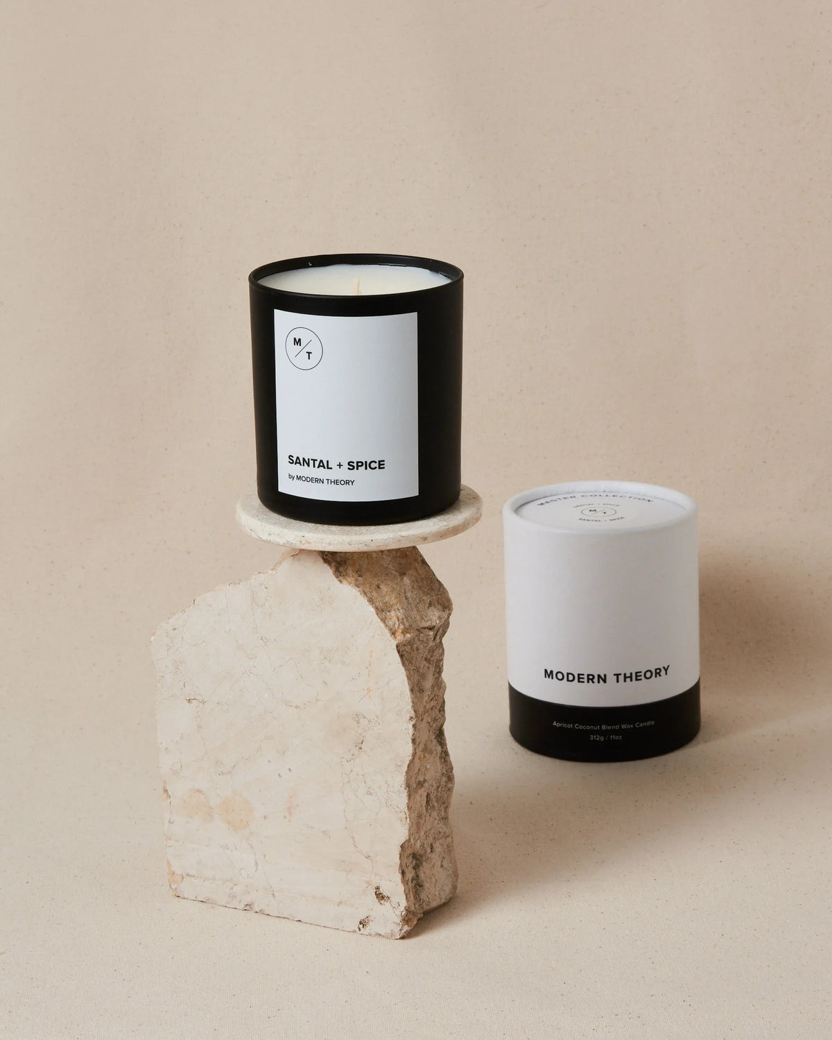 Close-up of the SANTAL + SPICE candle’s label highlighting its natural ingredients and clean design.